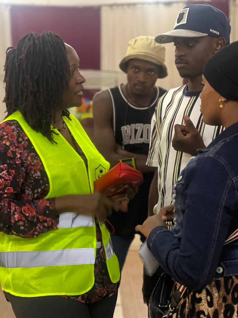 A community trainer leading an environmental session with schoolchildren